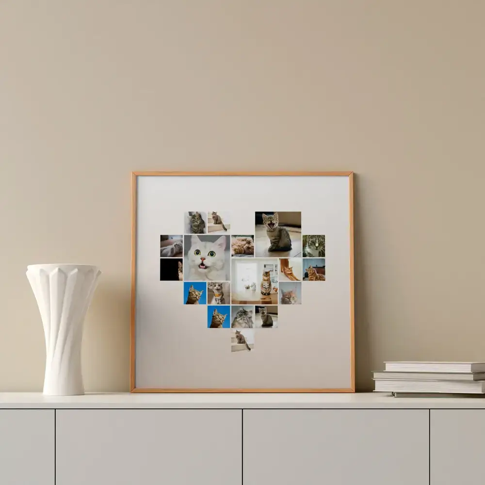 Collage di foto di gatti a forma di cuore in cornice di legno naturale su una credenza accanto a un vaso bianco e libri