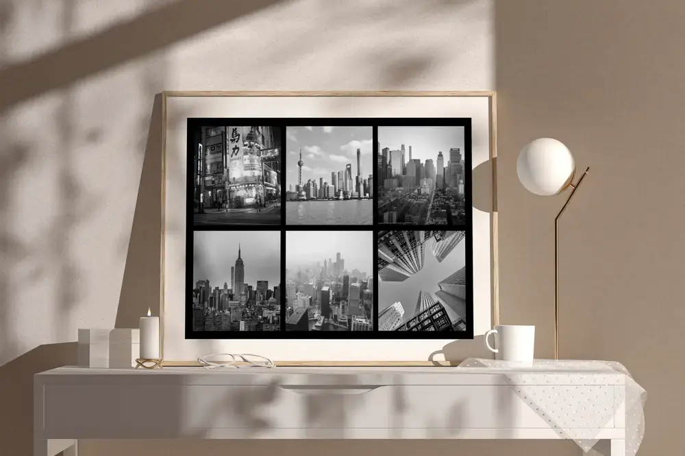 Collage di città in bianco e nero con cornice in legno su una credenza chiara, idea regalo in ricordo di un viaggio